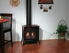 SPIRIT DV MEDIUM CAST IRON STOVE -IPI, NG PORCELAIN MAHOGANY W/ CONTOUR BURNER & LOG SET